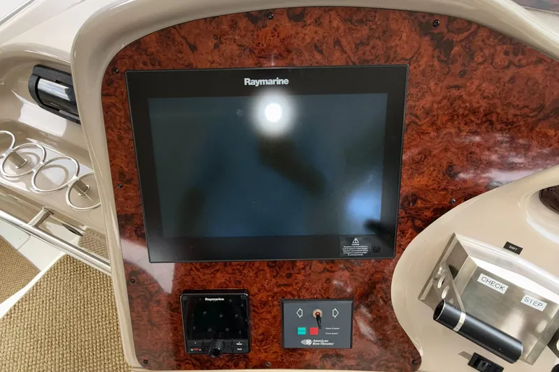 Slide: The Image of 1998 Sea Ray 540 Sundancer dashboard with Raymarine display and control panel. - 15
