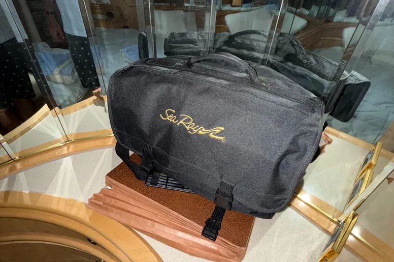 Slide: The Image of Black Sea Ray bag on a mirrored surface, reflecting the 1998 Sea Ray 540 Sundancer model. - 16