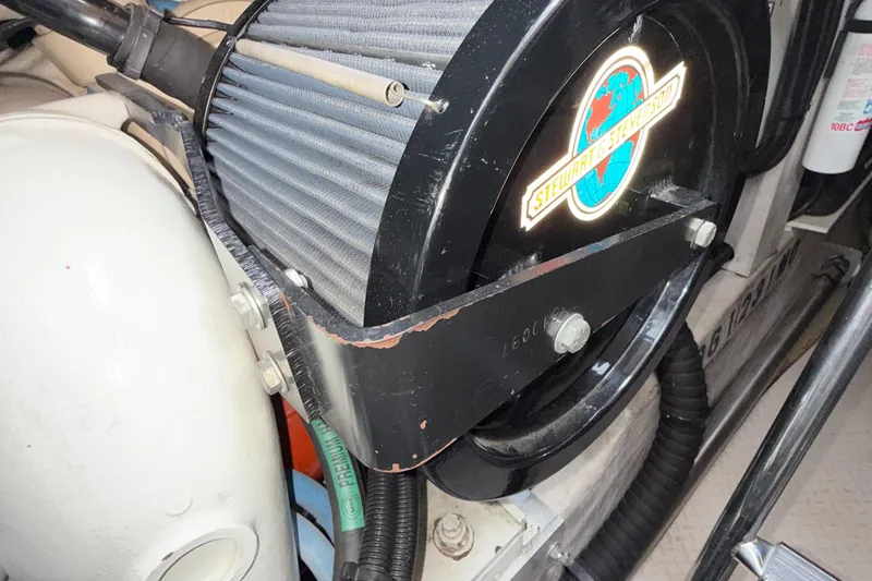 Slide: The Image of Engine component of a 1998 Sea Ray 540 Sundancer boat, featuring Stewart & Stevenson branding. - 19