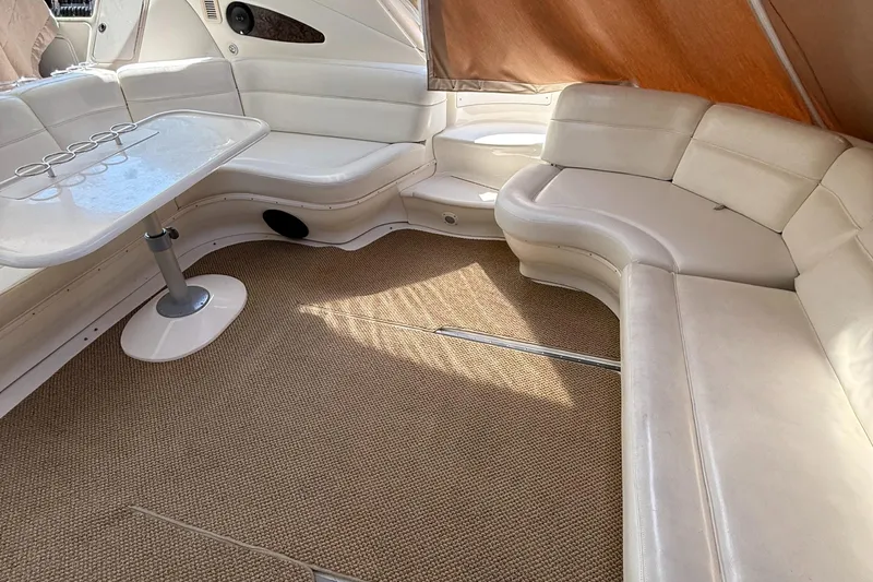 Slide: The Image of Luxurious interior of 1998 Sea Ray 540 Sundancer yacht with white leather seating. - 2