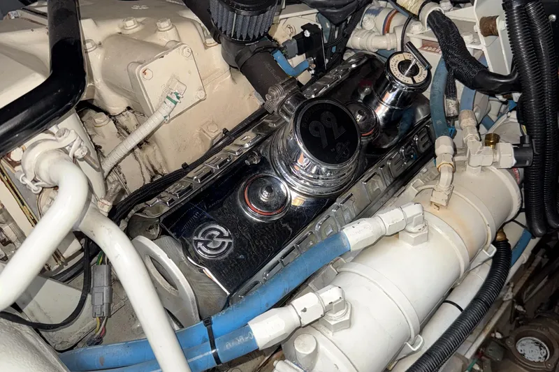 Slide: The Image of Engine compartment of a 1998 Sea Ray 540 Sundancer, showcasing mechanical components and wiring. - 21