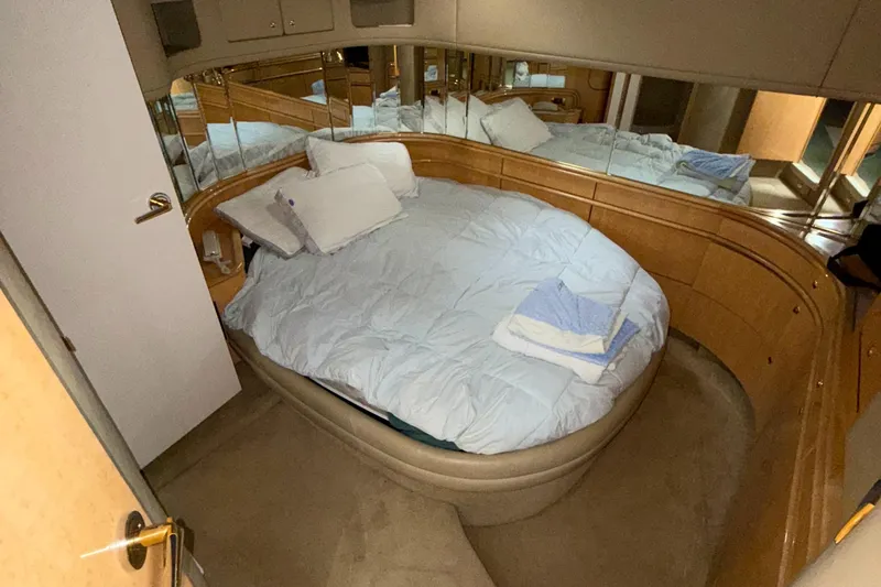 Slide: The Image of Luxurious bedroom interior of 1998 Sea Ray 540 Sundancer yacht with mirrored walls. - 22
