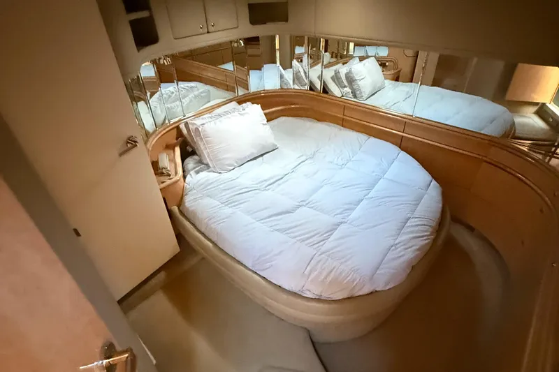 Slide: The Image of Luxurious bedroom interior of 1998 Sea Ray 540 Sundancer yacht with mirrored walls. - 4