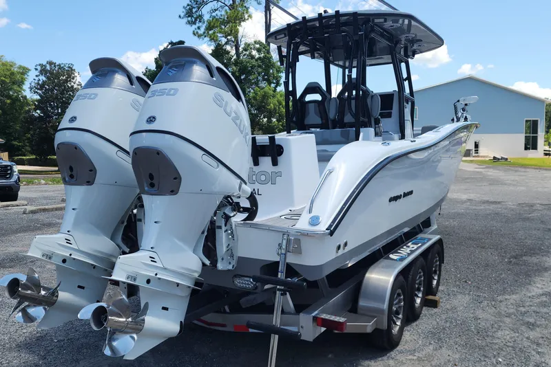 Slide: The Image of 2025 Cape Horn 32 XS boat with dual Suzuki 350 engines on a trailer. - 10