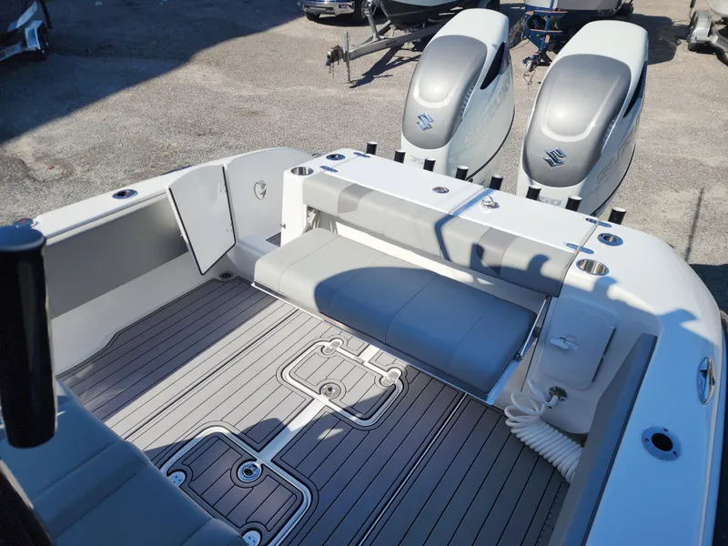 Slide: The Image of 2025 Cape Horn 32 XS boat interior with dual Suzuki engines, featuring sleek seating and deck design. - 12
