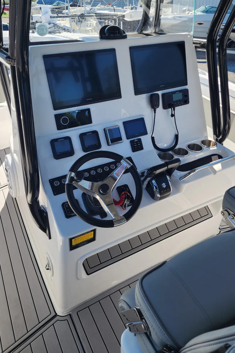 Slide: The Image of Control panel of 2025 Cape Horn 32 XS boat with modern navigation equipment. - 14
