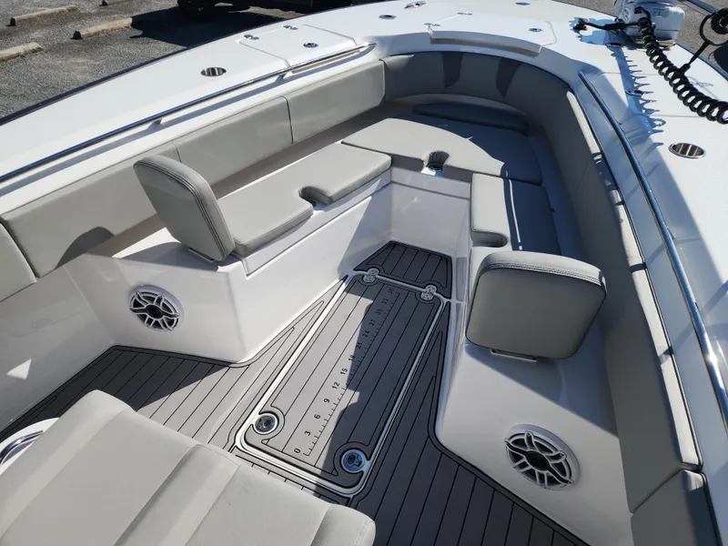 Slide: The Image of 2025 Cape Horn 32 XS boat interior with gray seating and deck, featuring modern design elements. - 15