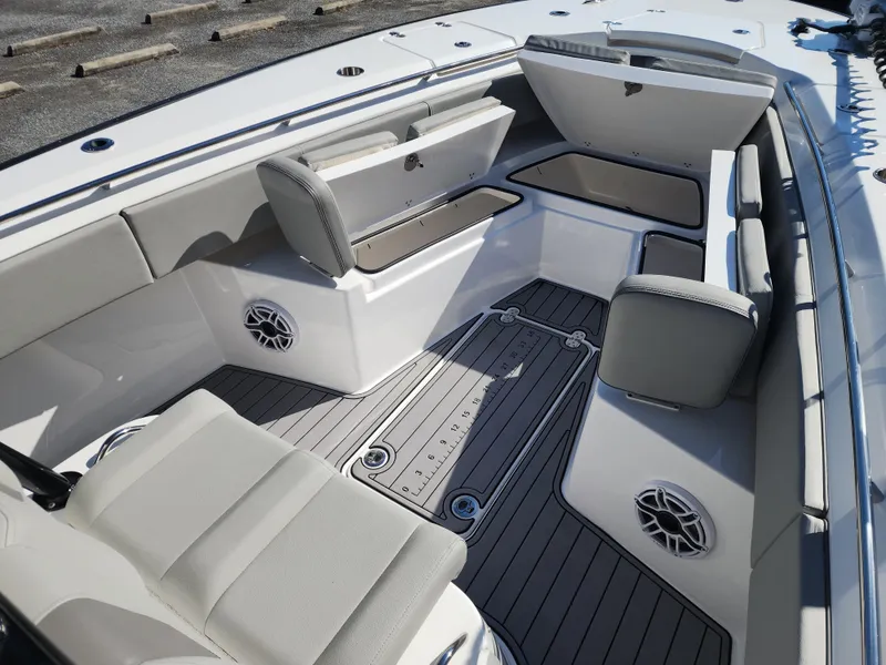 Slide: The Image of 2025 Cape Horn 32 XS boat interior with seating, storage, and speakers. - 17