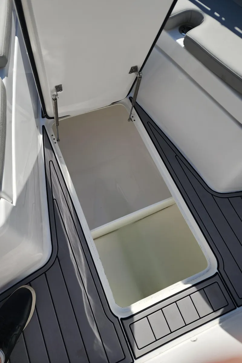 Slide: The Image of Open storage compartment on 2025 Cape Horn 32 XS boat deck. - 21