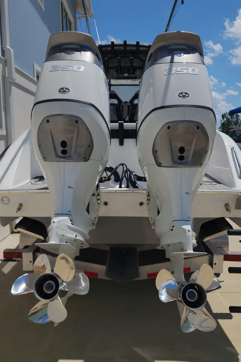 Slide: The Image of 2025 Cape Horn 32 XS boat with dual 350 horsepower outboard engines. - 9