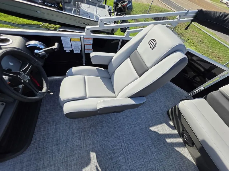 Slide: The Image of 2026 Sun Tracker Party Barge 20 DLX with spacious gray seating and sleek design. - 15