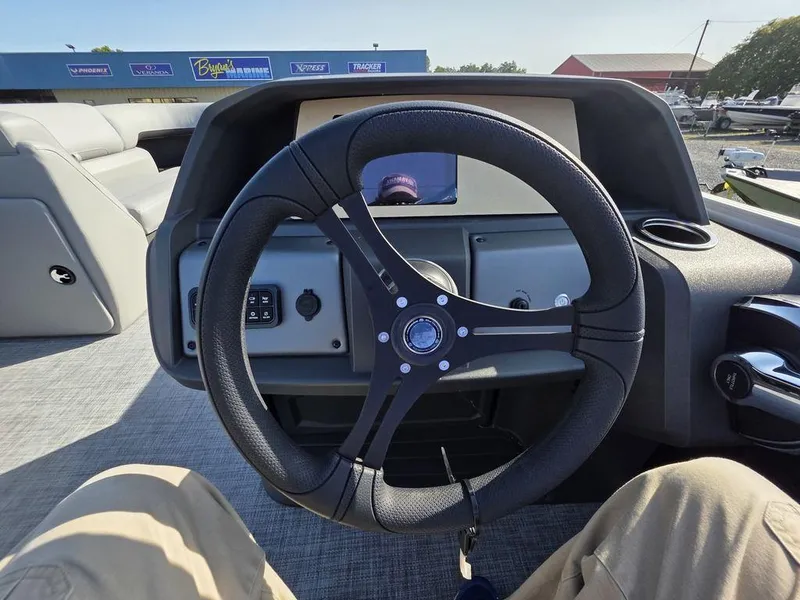 Slide: The Image of Control panel of 2026 Sun Tracker Party Barge 20 DLX with various function buttons. - 16