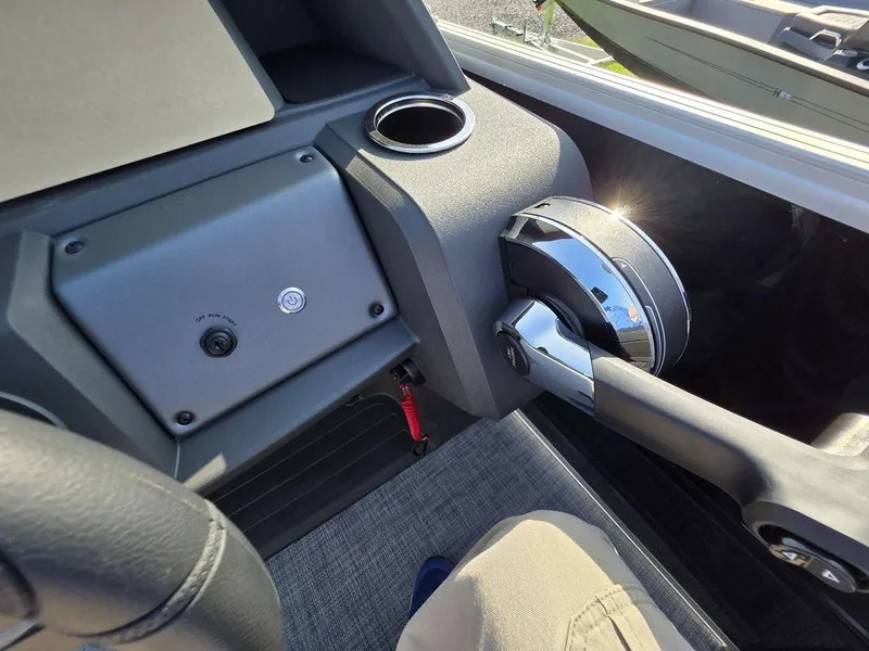 Slide: The Image of 2026 Sun Tracker Party Barge 20 DLX captain's chair and steering wheel. - 17