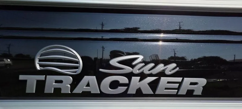 The Image of 2026 Sun Tracker Party Barge 20 DLX pontoon boat on trailer, side view. - 2