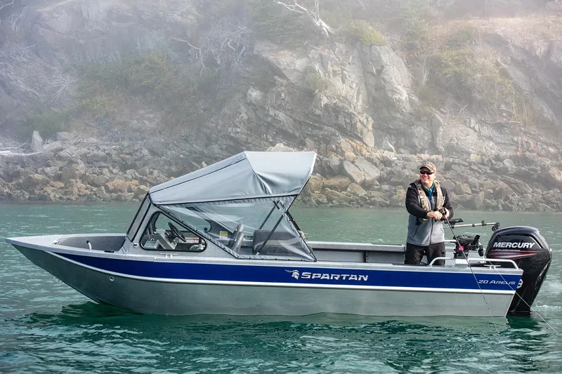 Slide: The Image of 2025 Spartan 20 Areus boat with Mercury engine on scenic waterway. - 12