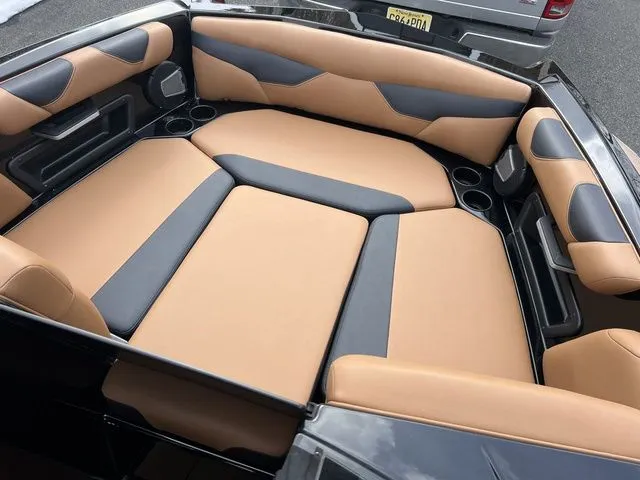 Slide: The Image of 2024 Axis Wake Research A20 boat interior with tan and gray seating. - 14