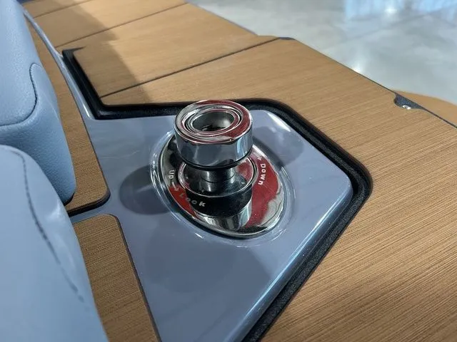 Slide: The Image of 2024 Axis Wake Research A225 boat detail with sleek wood and metal design. - 12