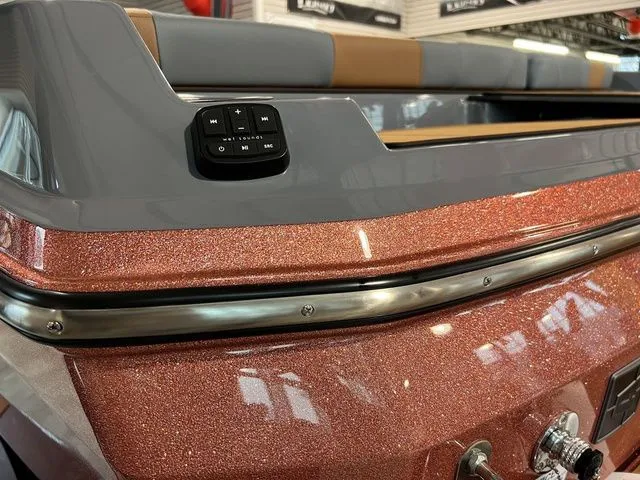 Slide: The Image of 2024 Axis Wake Research A225 boat with metallic finish and control panel. - 15