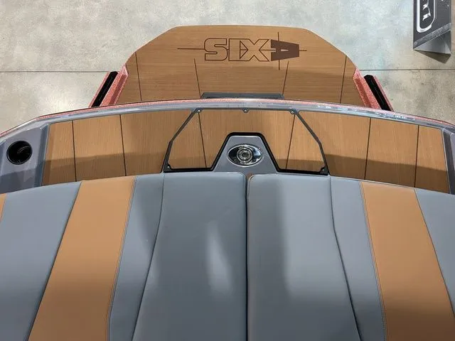 Slide: The Image of 2024 Axis Wake Research A225 boat interior with sleek gray and tan seating. - 16