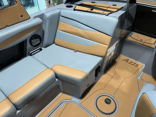 Slide: The Image of 2024 Axis Wake Research A225 interior with tan and gray seating, modern design. - 19