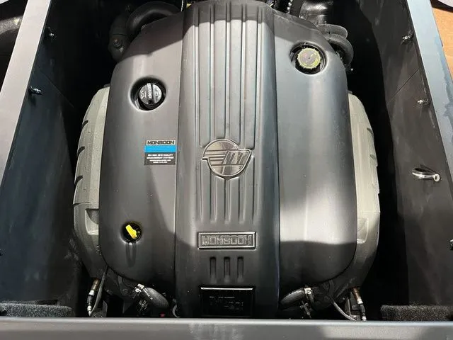 Slide: The Image of 2024 Axis Wake Research A225 engine, Monsoon model, in a sleek black casing. - 8