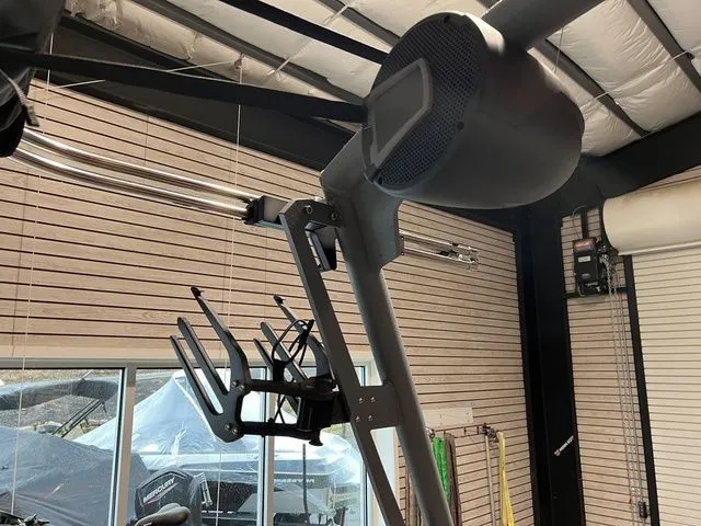 Slide: The Image of 2024 Axis Wake Research A225 boat tower with speaker and board rack in a showroom. - 9