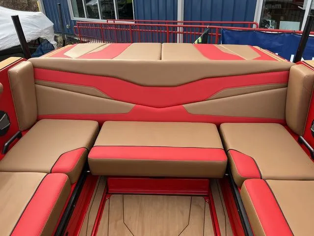 Slide: The Image of 2024 Axis Wake Research T235 boat interior with red and tan seating. - 12