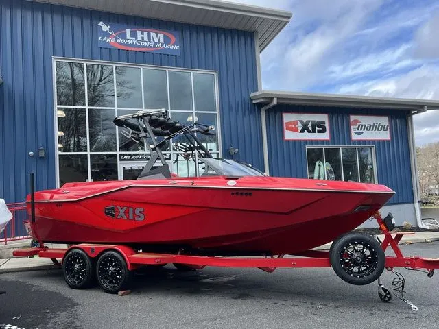 Slide: The Image of 2024 Axis Wake Research T235 boat in vibrant red at Lake Hopatcong Marine. - 4