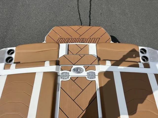 Slide: The Image of 2024 Malibu 23 LSV boat deck with tan and white upholstery. - 6