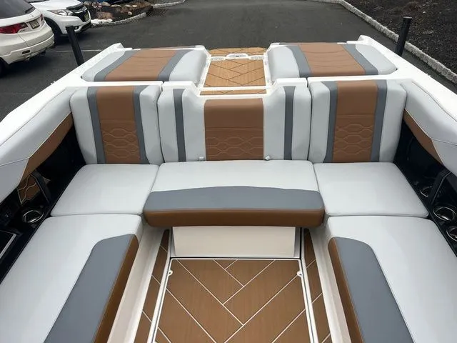 Slide: The Image of 2024 Malibu 23 LSV boat interior with luxurious seating and modern design. - 7