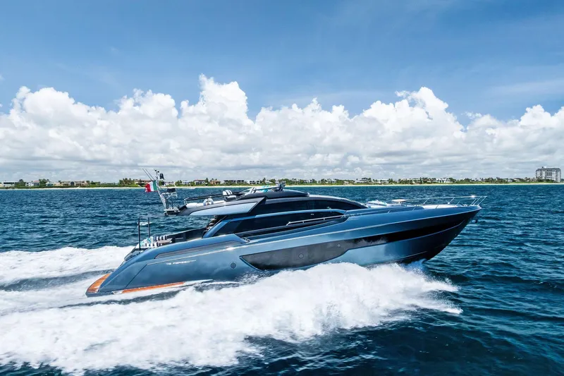 The Image of 2024 Riva 76 PERSEO Super yacht cruising on open water under a clear blue sky. - 1