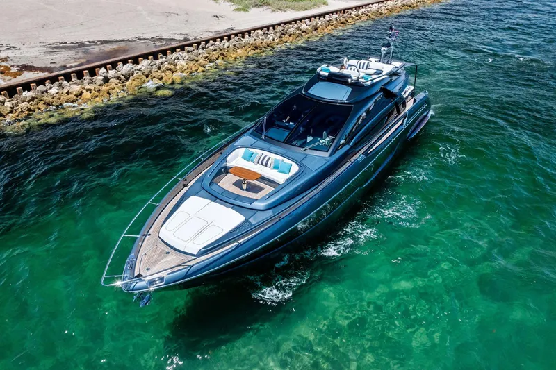 Slide: The Image of Luxurious 2024 Riva 76 PERSEO Super yacht cruising in clear turquoise waters. - 12