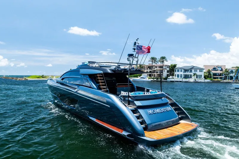 Slide: The Image of 2024 Riva 76 PERSEO Super yacht cruising on a sunny day near waterfront homes. - 13