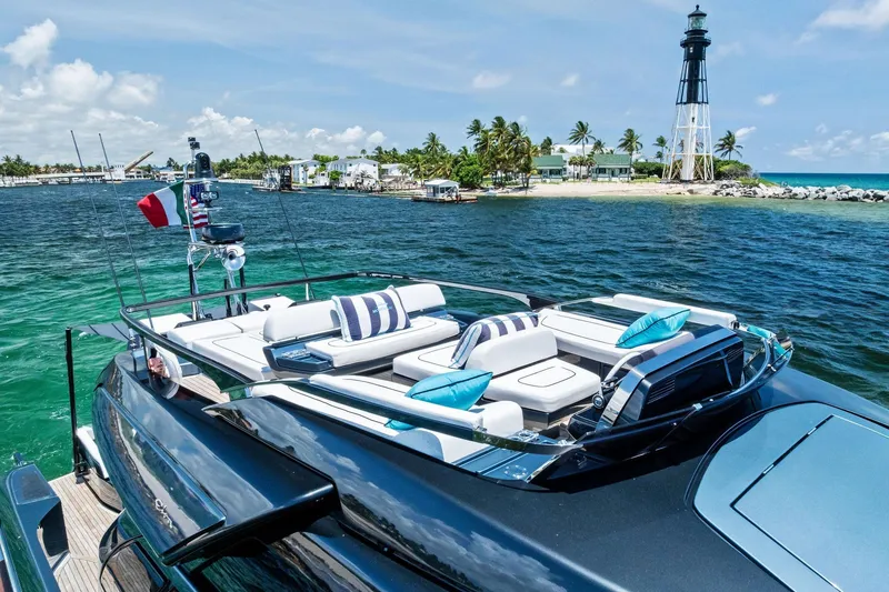 Slide: The Image of Luxurious 2024 Riva 76 PERSEO Super yacht near a scenic lighthouse and tropical island. - 17