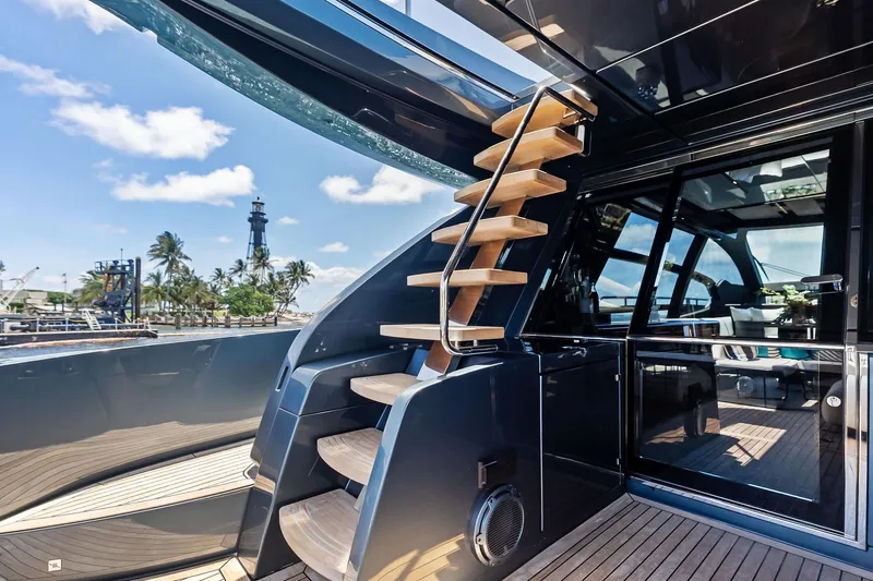 Slide: The Image of Luxurious 2024 Riva 76 PERSEO Super yacht with sleek design and wooden staircase. - 27
