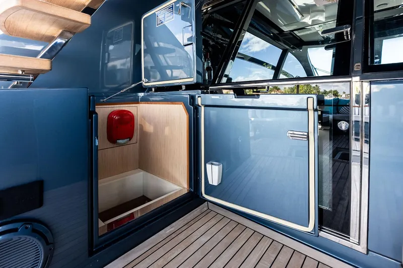 Slide: The Image of 2024 Riva 76 PERSEO Super yacht interior with sleek blue doors and wooden flooring. - 33