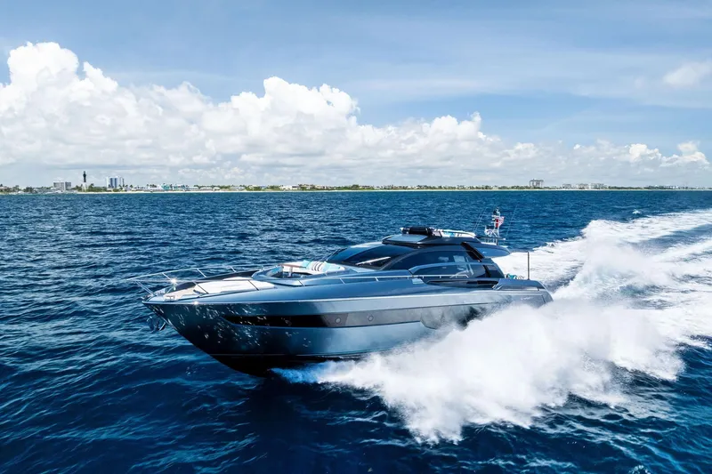 Slide: The Image of 2024 Riva 76 PERSEO Super yacht cruising on open water under clear skies. - 4