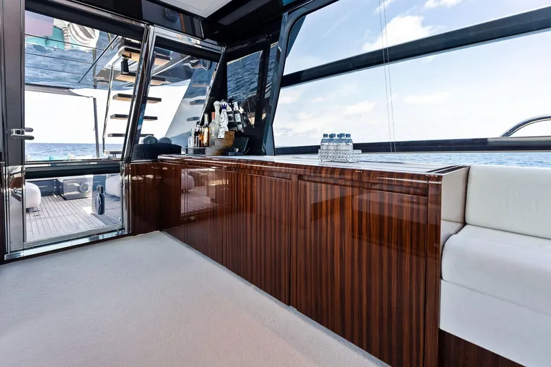 Slide: The Image of Luxurious interior of 2024 Riva 76 PERSEO Super yacht with elegant wood finish and ocean view. - 46