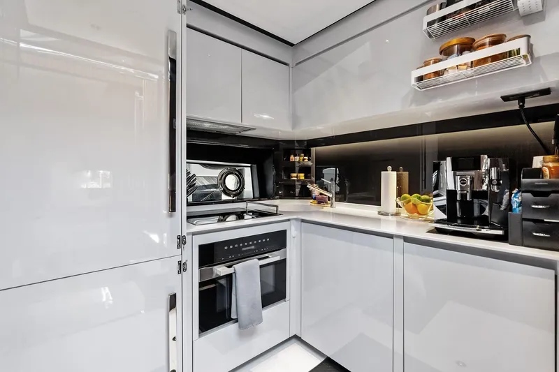 Slide: The Image of Luxurious kitchen interior of 2024 Riva 76 PERSEO Super yacht, featuring modern appliances and sleek design. - 62
