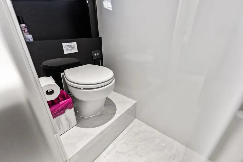 Slide: The Image of Luxurious bathroom on 2024 Riva 76 PERSEO Super yacht with modern toilet and marble flooring. - 74