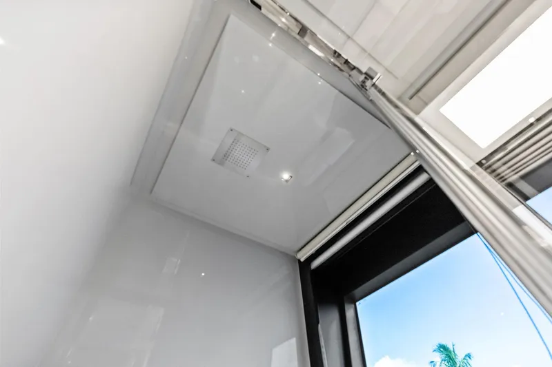 Slide: The Image of Interior view of 2024 Riva 76 PERSEO Super yacht, featuring sleek modern design and skylight. - 76