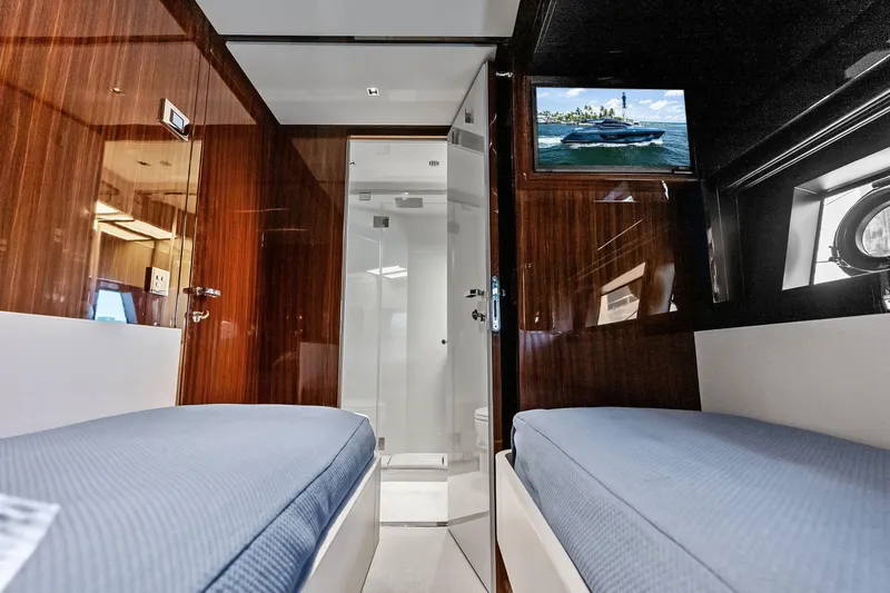 Slide: The Image of Luxurious interior of 2024 Riva 76 PERSEO Super yacht with twin beds and TV. - 84