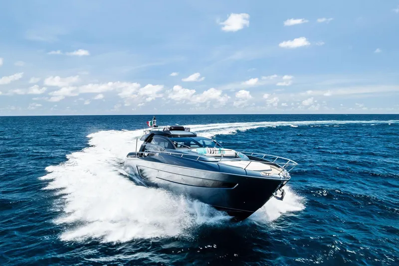 Slide: The Image of 2024 Riva 76 PERSEO Super yacht cruising on open sea under clear skies. - 9