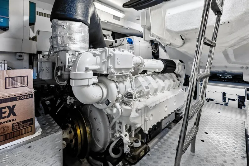 Slide: The Image of Engine room of 2024 Riva 76 PERSEO Super yacht, featuring a powerful engine and metallic ladder. - 94