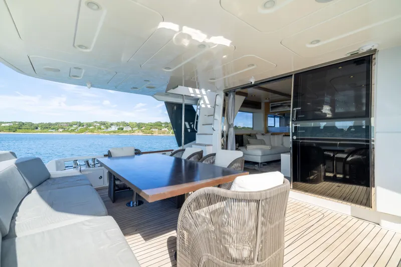 Slide: The Image of Luxurious 2019 Sirena 64 yacht deck with elegant seating and ocean view. - 16