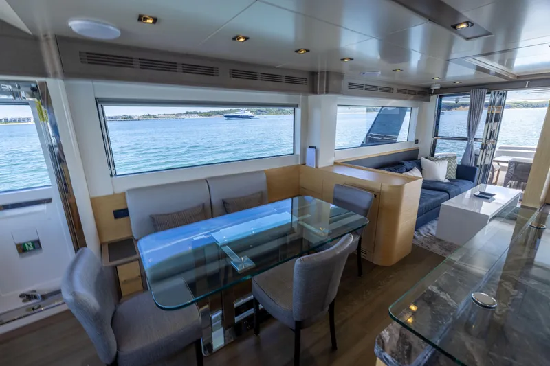 Slide: The Image of Luxurious interior of 2019 Sirena 64 yacht with elegant dining and lounge area. - 25