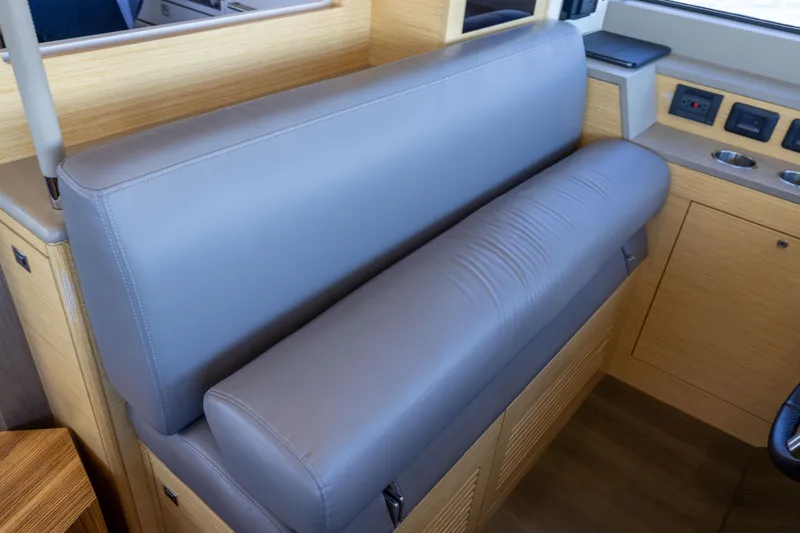 Slide: The Image of Luxurious interior seating of 2019 Sirena 64 yacht with sleek gray upholstery. - 37