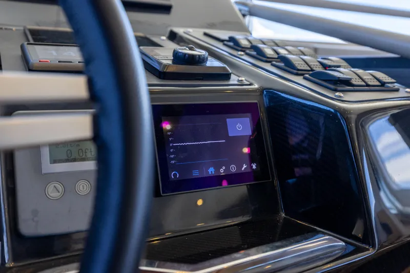 Slide: The Image of Control panel of 2019 Sirena 64 yacht with touchscreen and navigation controls. - 42