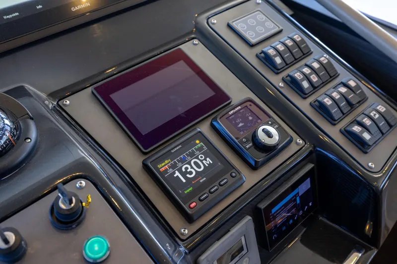 Slide: The Image of Control panel of 2019 Sirena 64 yacht with navigation and system displays. - 43