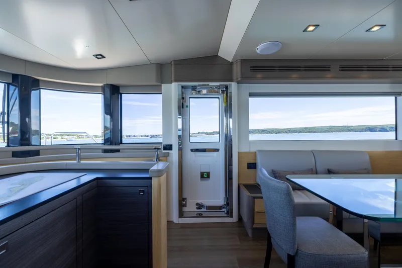 Slide: The Image of Luxurious interior of 2019 Sirena 64 yacht with panoramic windows and modern furnishings. - 44